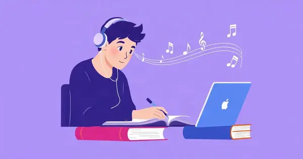 Студент в наушниках занимается за столом с книгами и ноутбуком, вокруг ноты