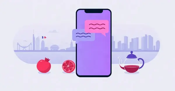 Переписка на смартфоне, рядом гранат и чайник, на фоне силуэт приморского города